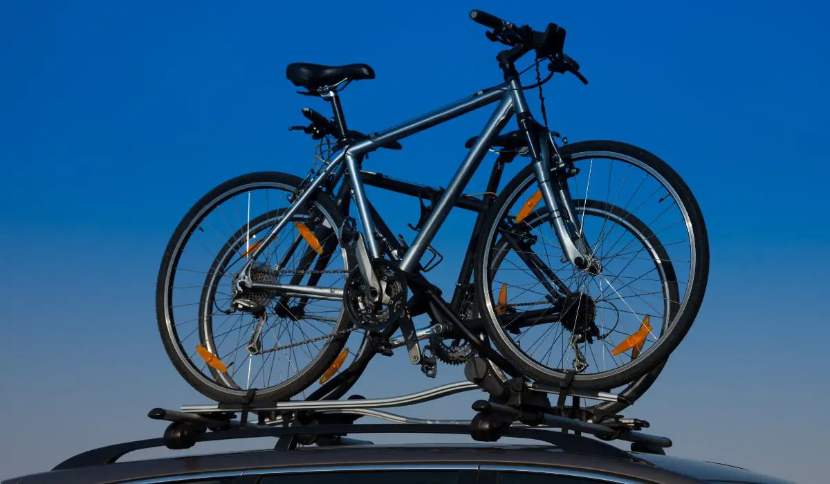 2 Bikes mounted on a rooftop rack.