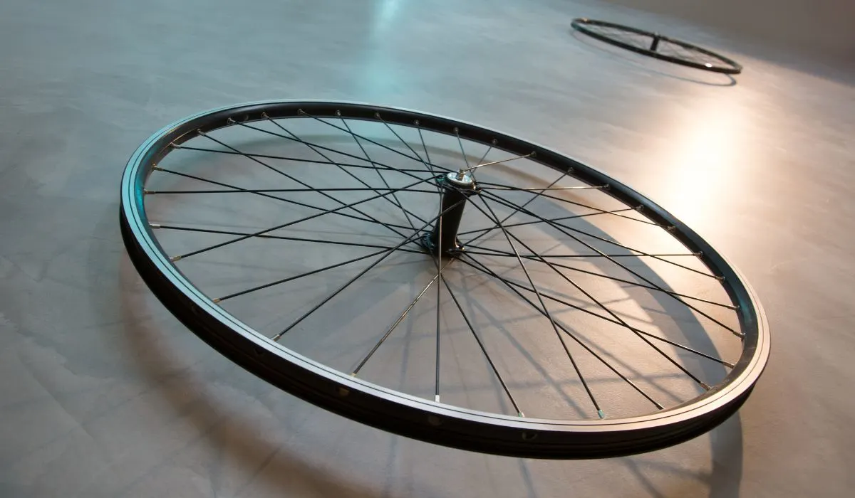 A bike rim disassembled from a the bike. 