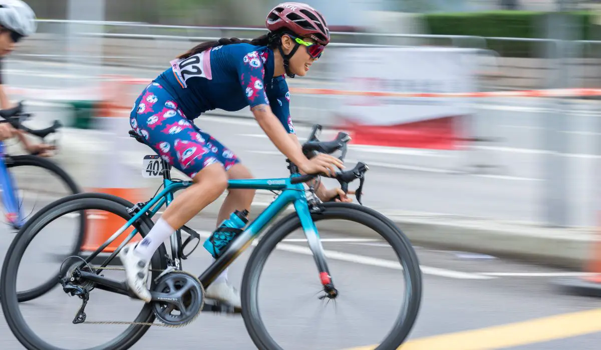 A woman racing a road bike. 