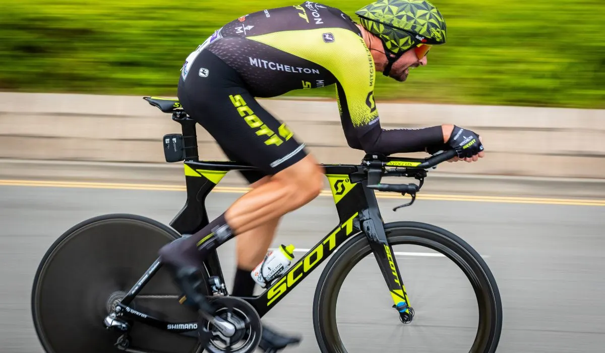 A mad riding a Scott brand racing bike. 