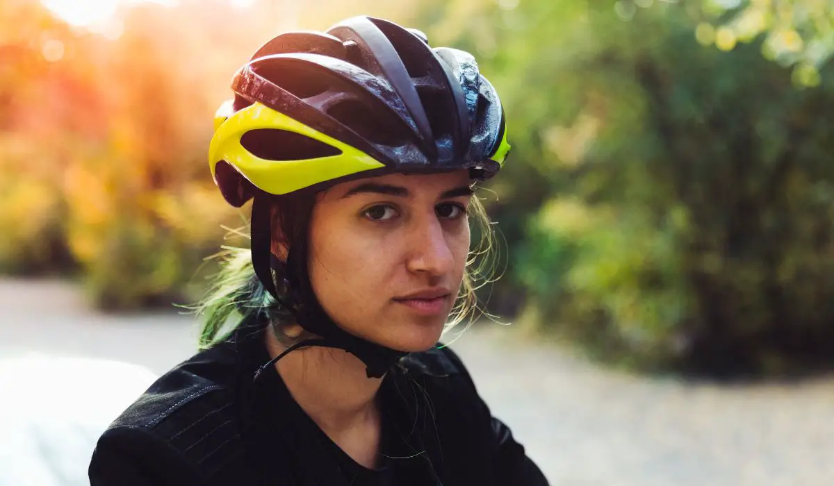 A person with a bike helmet on. 