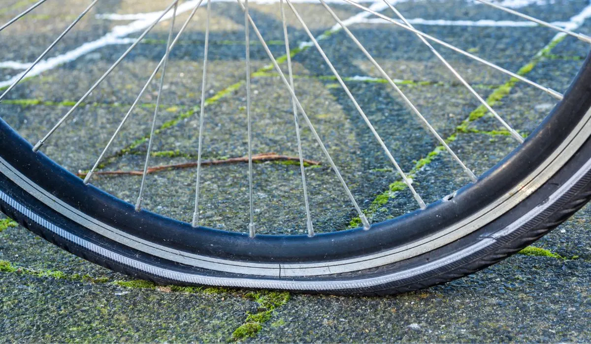 A close up of a flat bike tire.