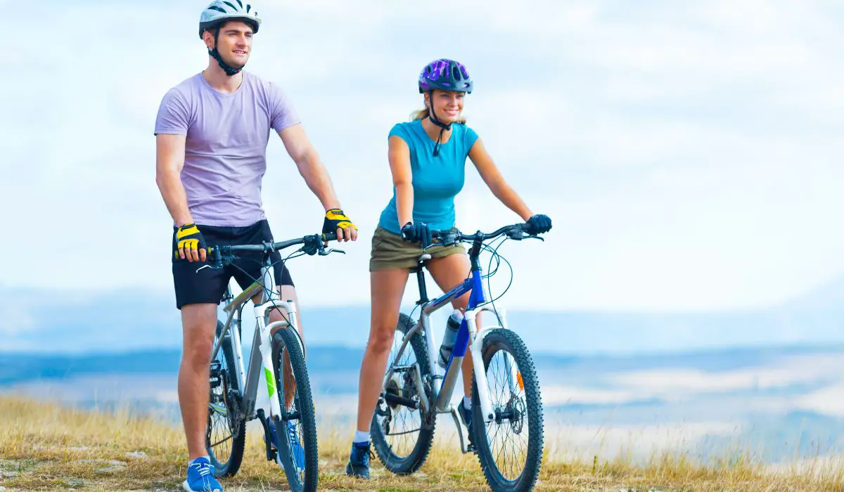 2 people on bikes with bike clothing on.