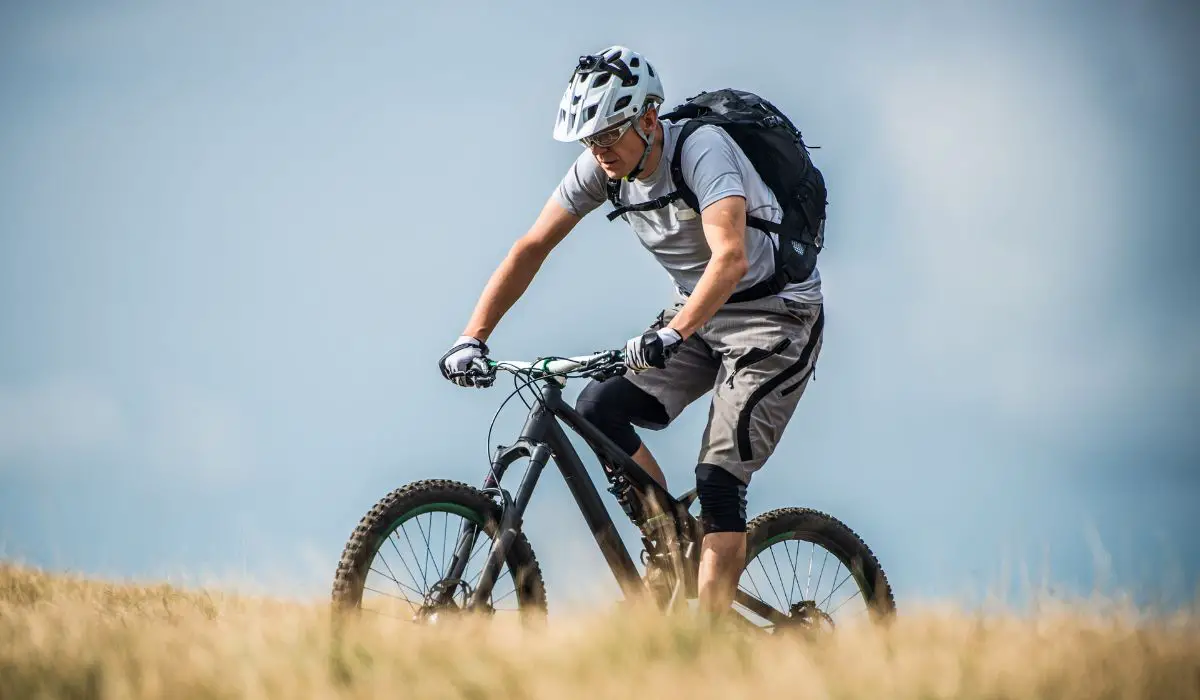 A man riding a mountain bike. 